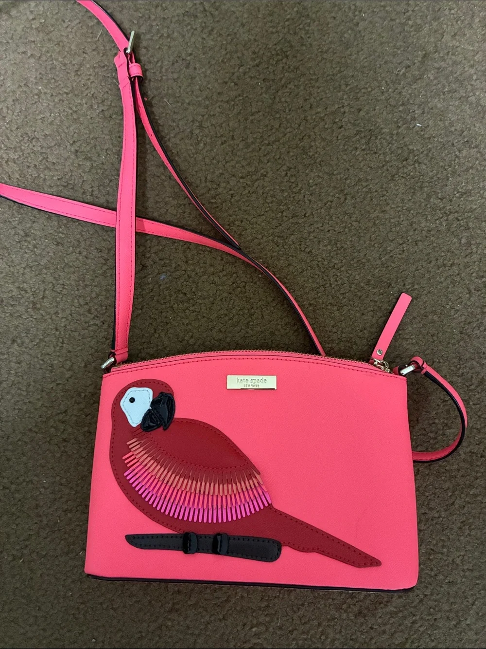 kate spade hot pink crossbody with parrot appliqué